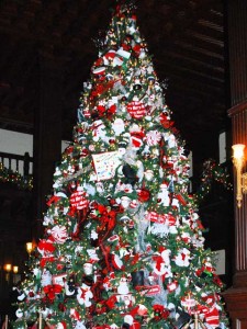 ChristmasTree_HotelDelLobby This is a photo of the famous Christmas tree in the lobby of the Hotel Del Coronado. It is at least twenty feet tall and heavily decorated with candy- and Christmas-themed ornaments and white lights.