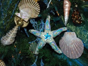 Starfish_Ornament_HotelDel This is a photo of a starfish Chrsitmas ornament in aqua blue and pearl colors.