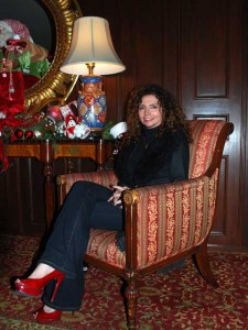 Tina Benino This is a photo of Tina Benino sitting in a chair in the lobby of the Hotel Del Coronado. The hotel is decorated for Christmas and everything is merry and bright. Including the visitors!